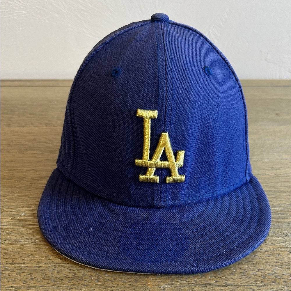 New Era Los Angeles Dodgers Navy Blue Fitted Hat with Gold LA Logo. Adjustable.